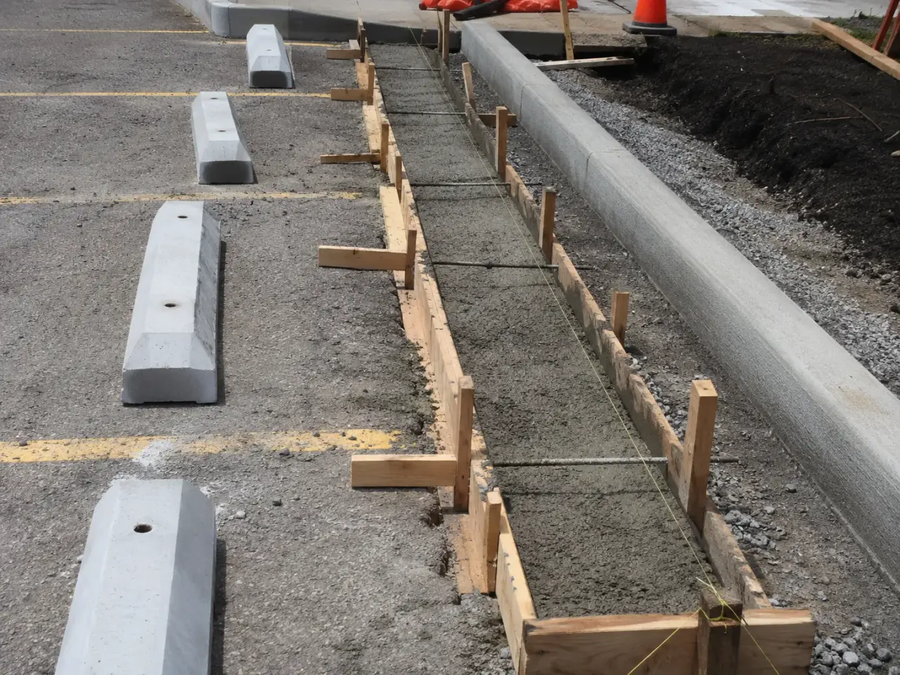 How we install wheel stops and parking curbs by Harrowgate Group